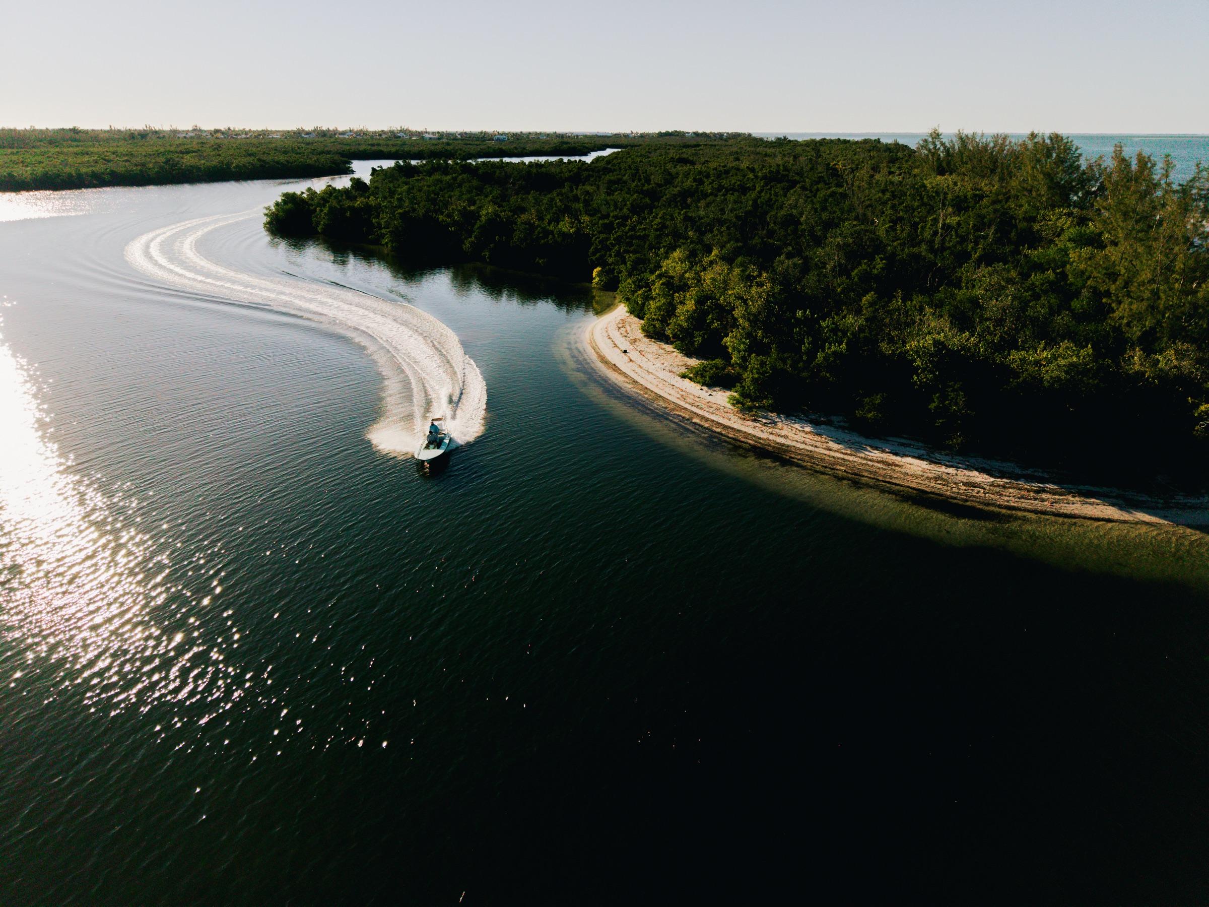 Aerial of a fishing skiff working a sandbar in Pine Island Sound