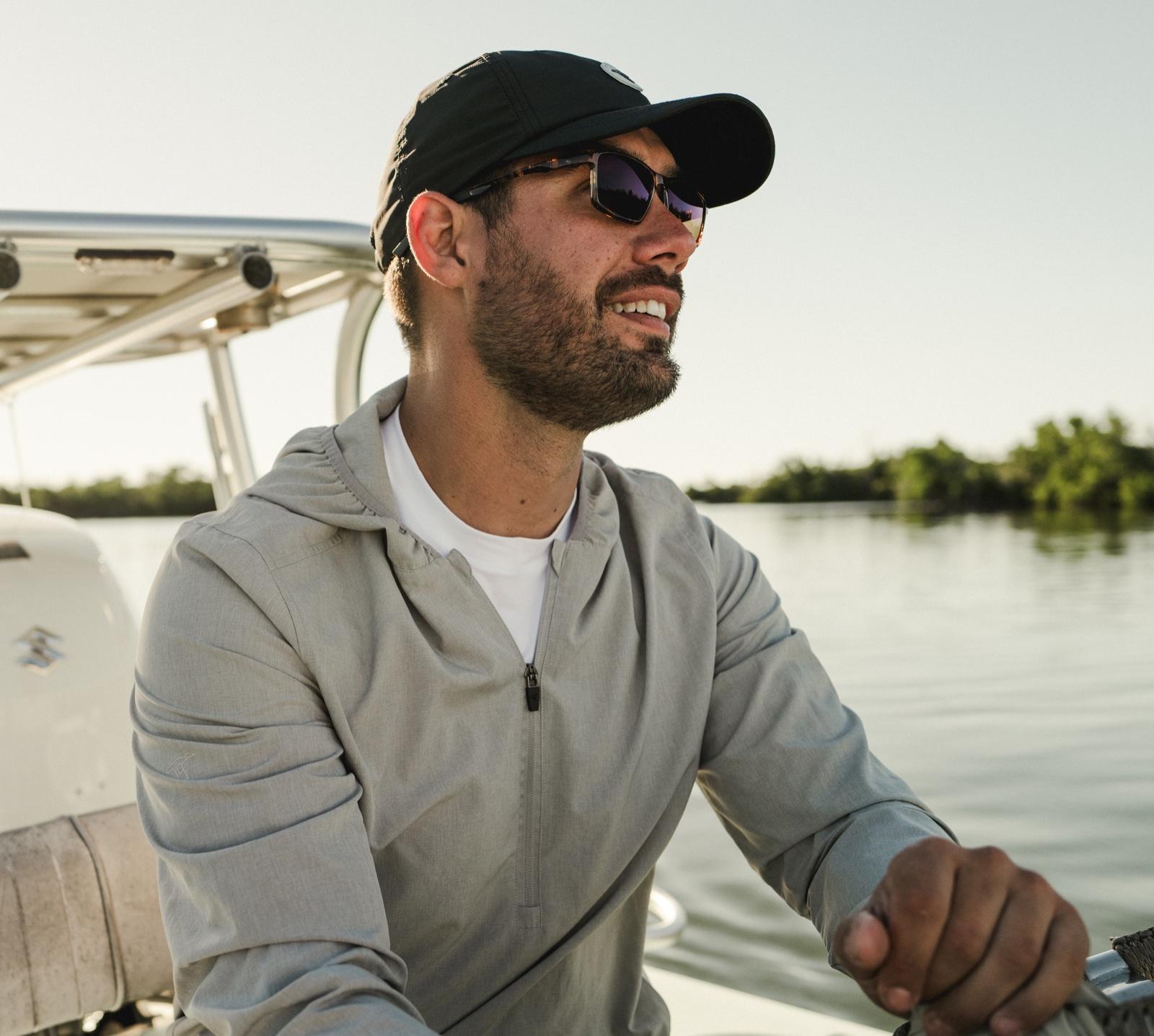 Captain Stuart Anson Behrens at the helm of his Beavertail Mosquito skiff