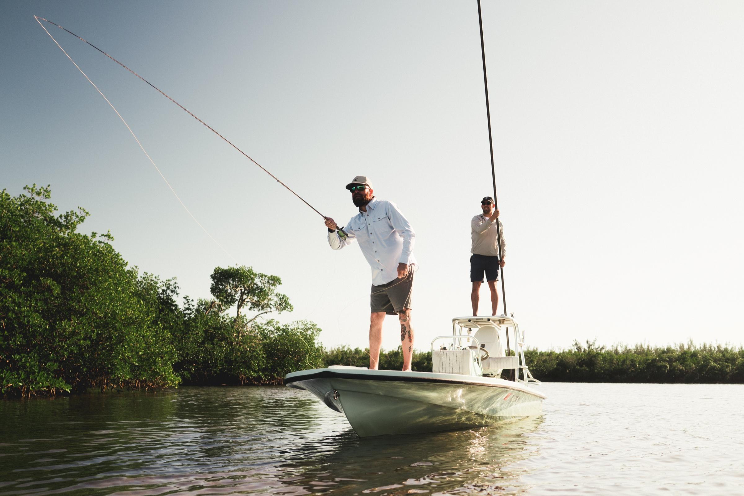 Angler casting a fly rod from the bow